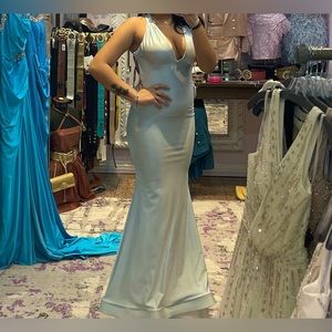 Light Blue gown. Open Back. Size Extra small. Stretch Fit. Worn once